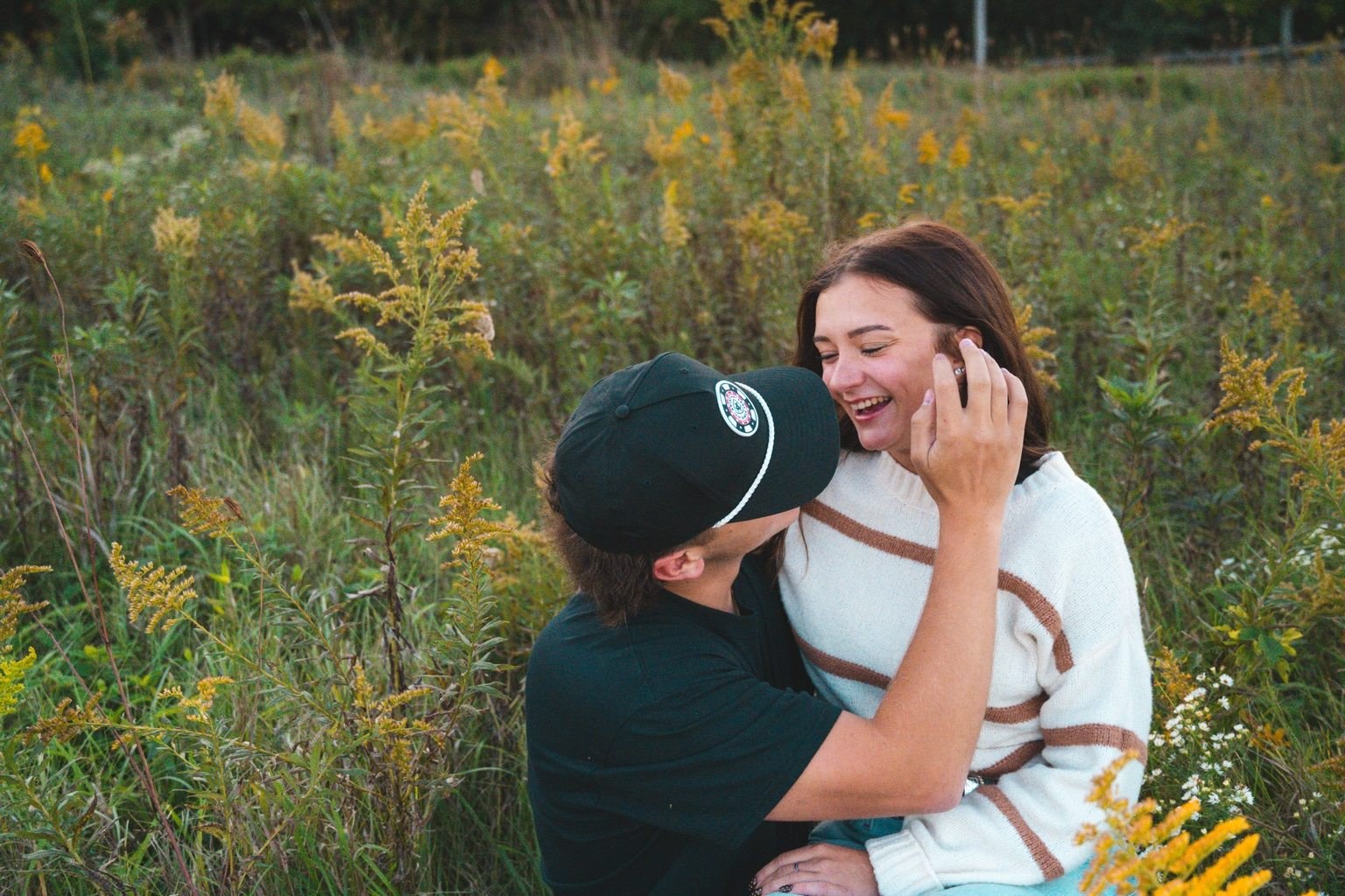Couple enjoying a sunlit moment outdoors